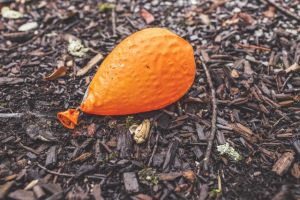 ground-orange-balloon-deflated